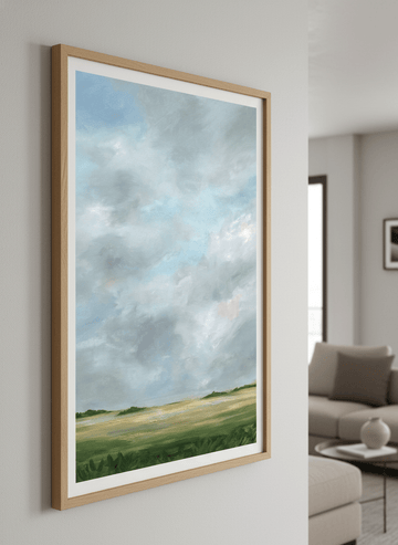 Modern wall art styled above a sofa in a neutral living room