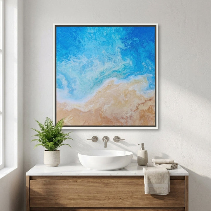 Canvas wall art with a white surround styled in a clean minimalist bathroom