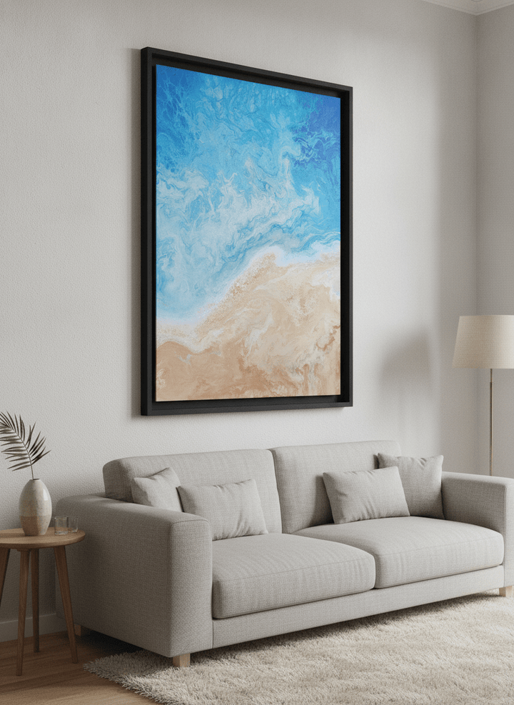 Modern wall art styled above a sofa in a neutral living room