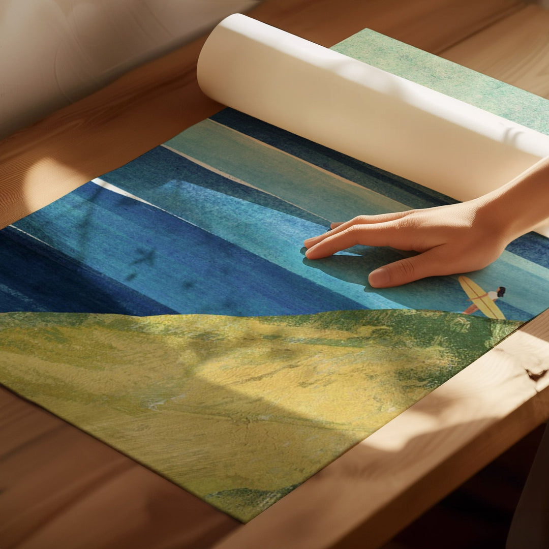 Hand rolling out a colorful rug on a wooden floor
