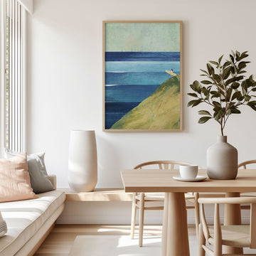 Modern living room with a painting of a landscape, a sofa, and a dining table.