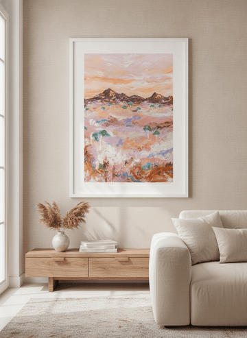 Modern wall art styled above a sofa in a neutral living room