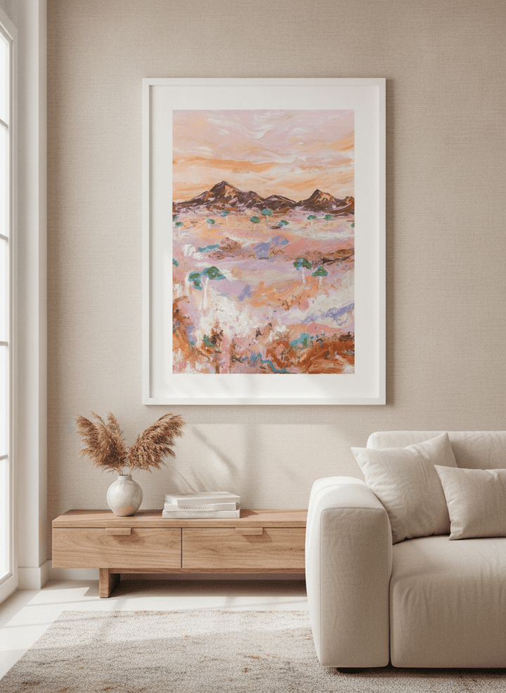 Modern wall art styled above a sofa in a neutral living room