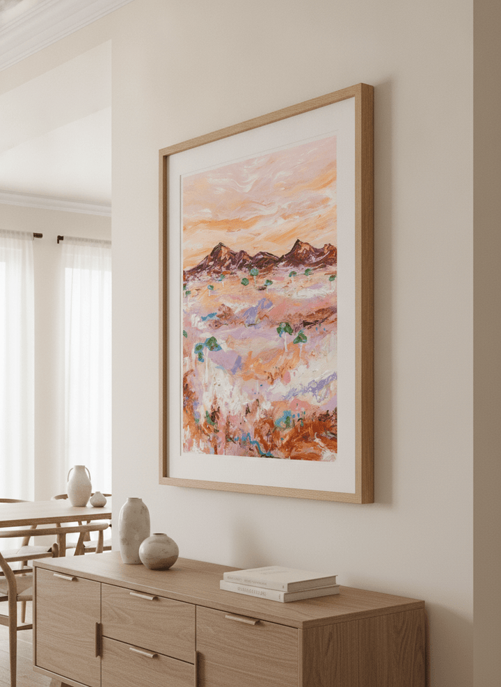 Wall art styled above a dining table in a contemporary home
