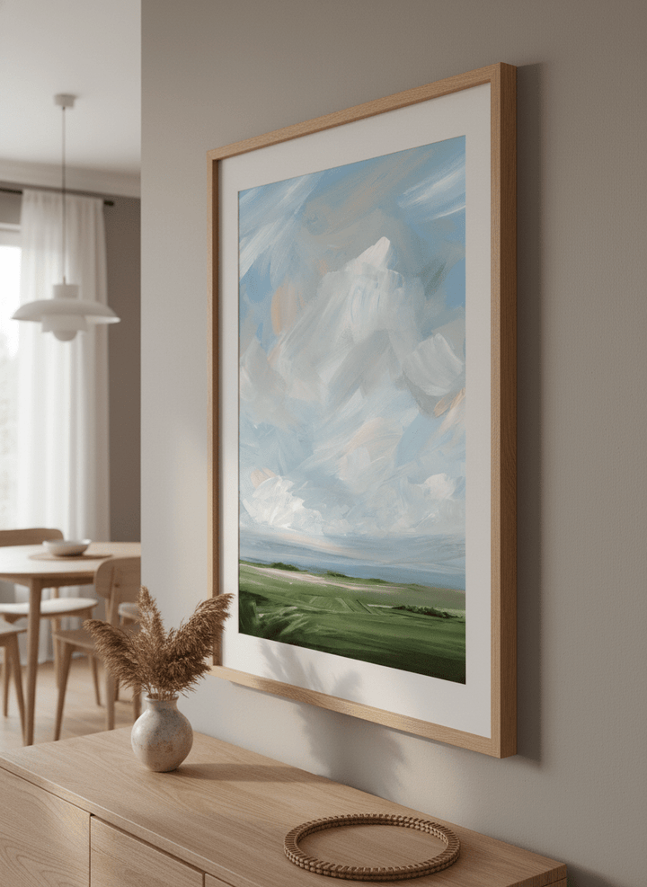Wall art styled above a dining table in a contemporary home