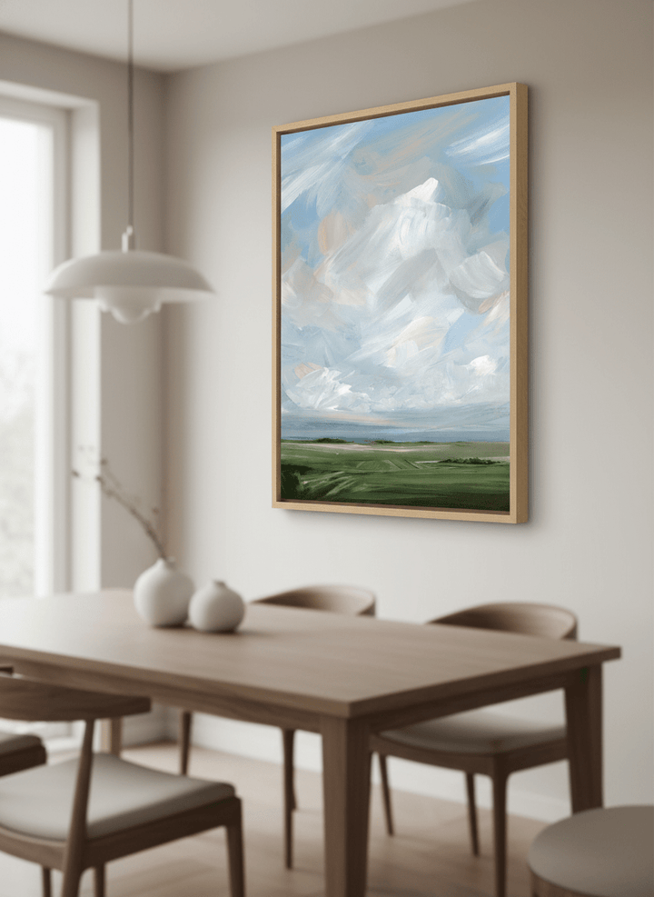Wall art styled above a dining table in a contemporary home