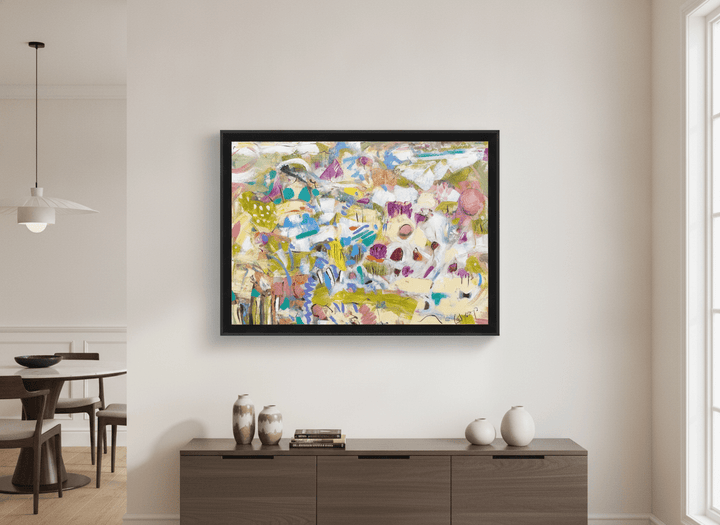 Wall art styled above a dining table in a contemporary home