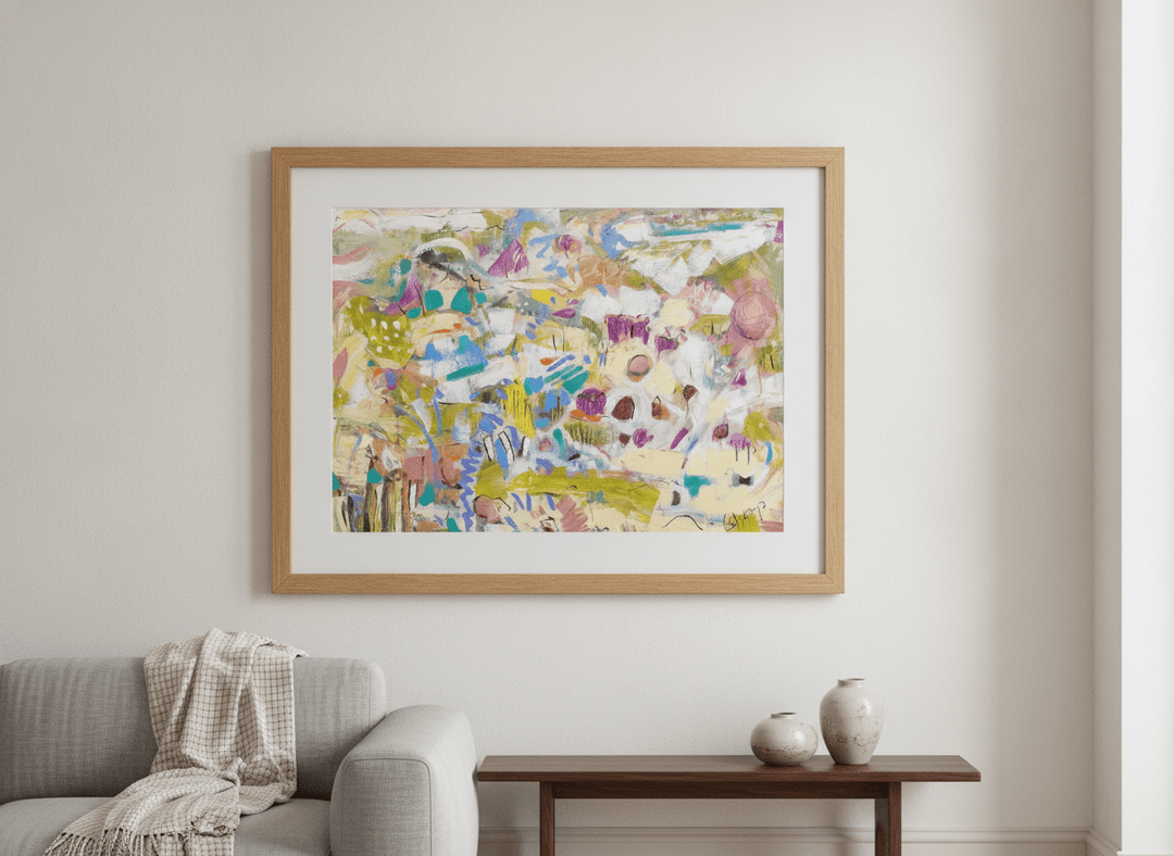 Modern wall art styled above a sofa in a neutral living room