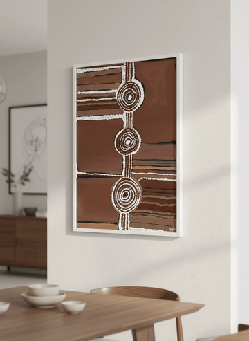 Wall art styled above a dining table in a contemporary home
