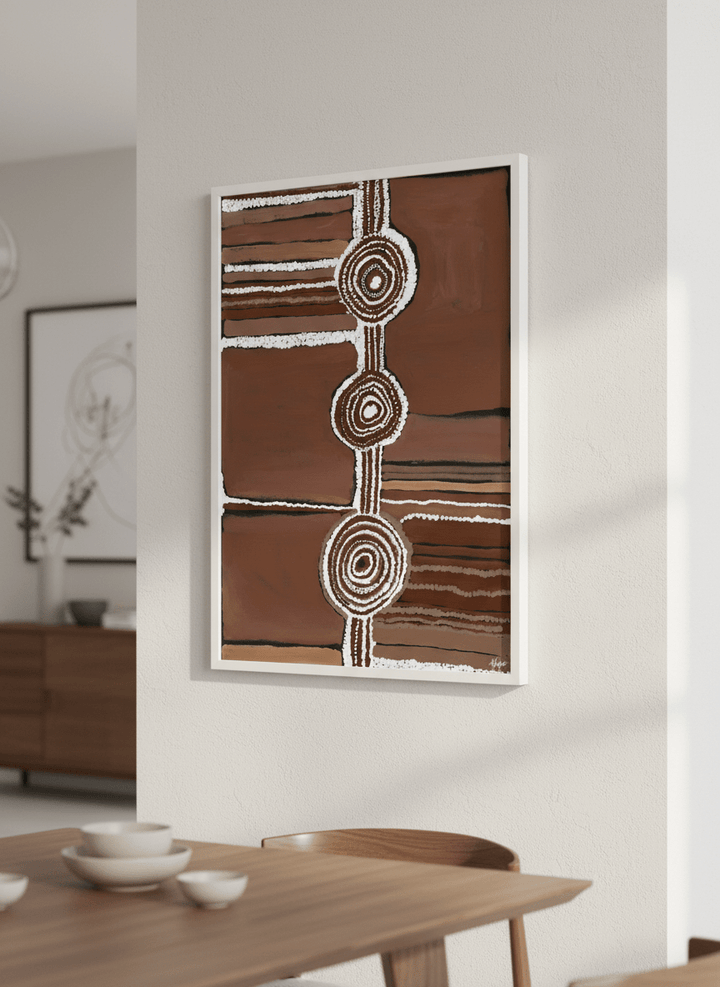 Wall art styled above a dining table in a contemporary home