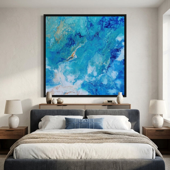 Canvas wall art with a black surround styled in a calm, light-filled bedroom