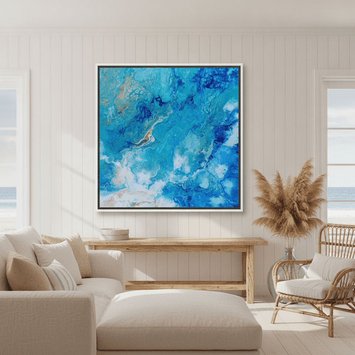 Oversized statement canvas wall art with a white surround styled in a sunny coastal beach house