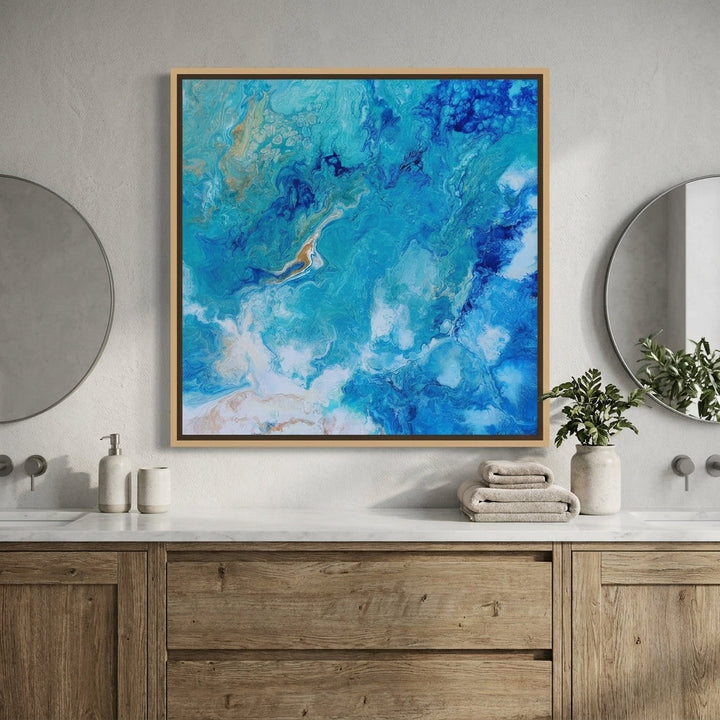 Canvas wall art with a natural timber surround styled in a clean minimalist bathroom