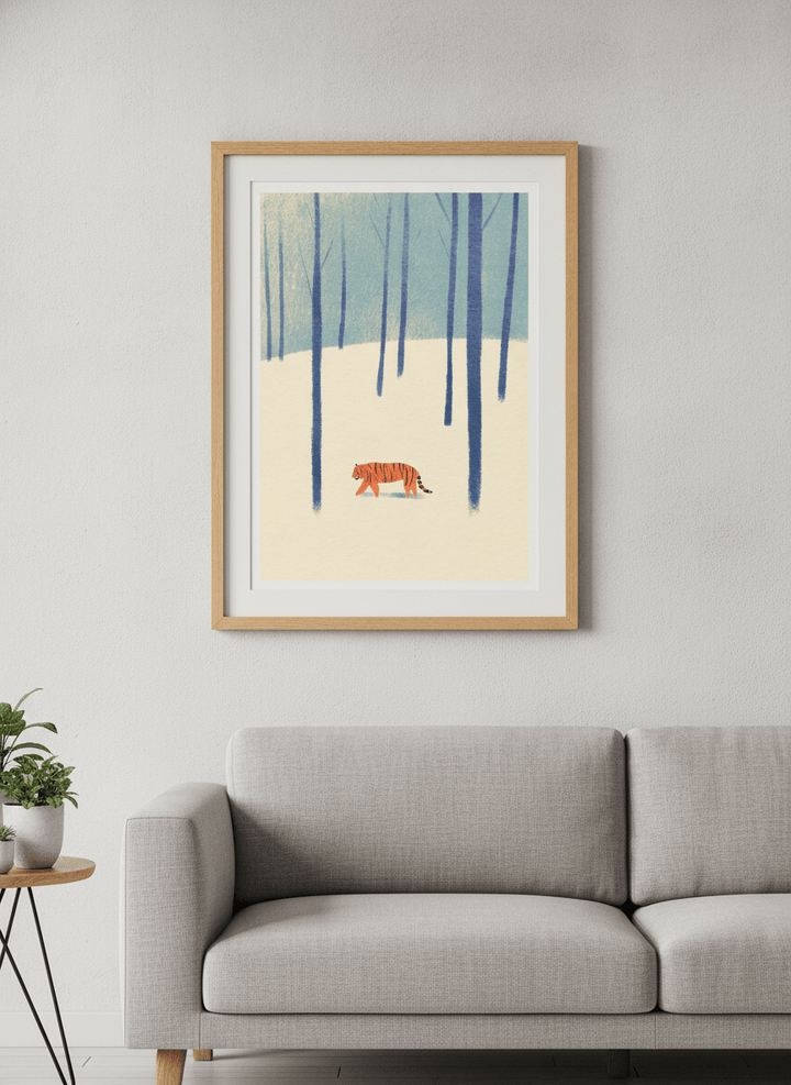 Modern wall art styled above a sofa in a neutral living room