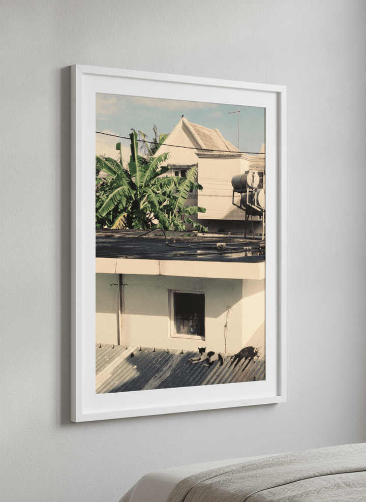 Minimalist artwork displayed in a calm, light-filled bedroom interior