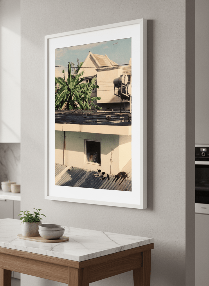 Artwork styled on the wall of a bright modern kitchen