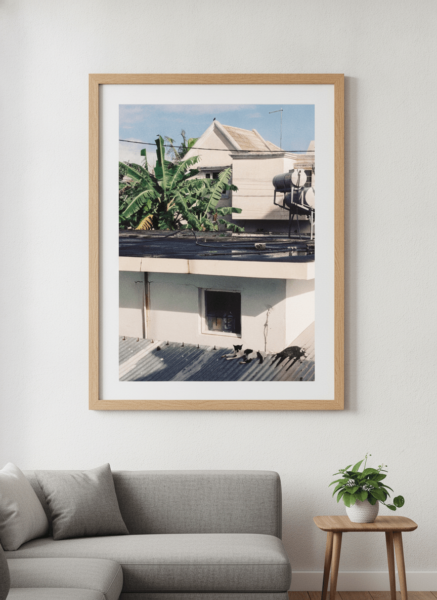 Modern wall art styled above a sofa in a neutral living room