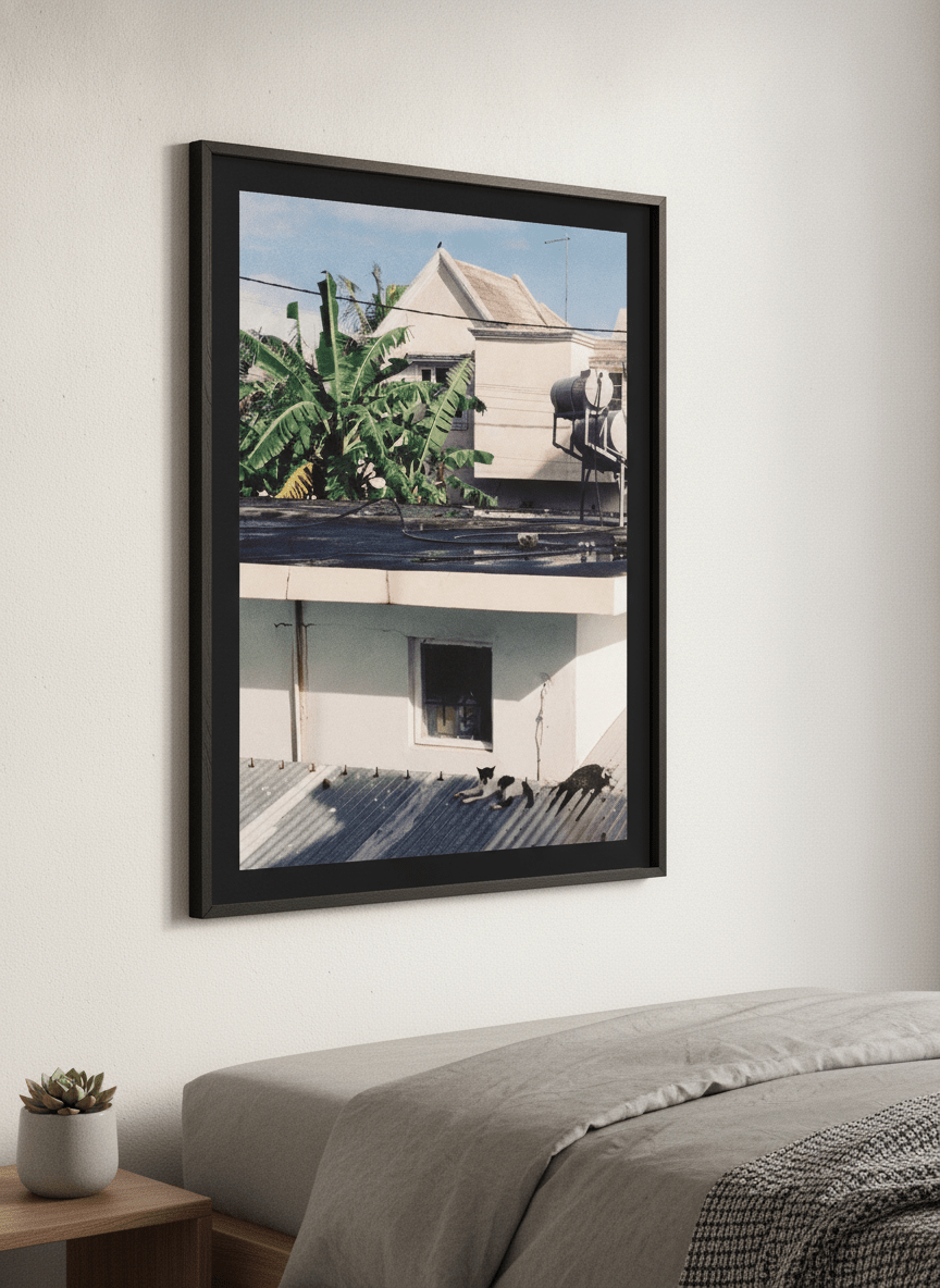 Minimalist artwork displayed in a calm, light-filled bedroom interior