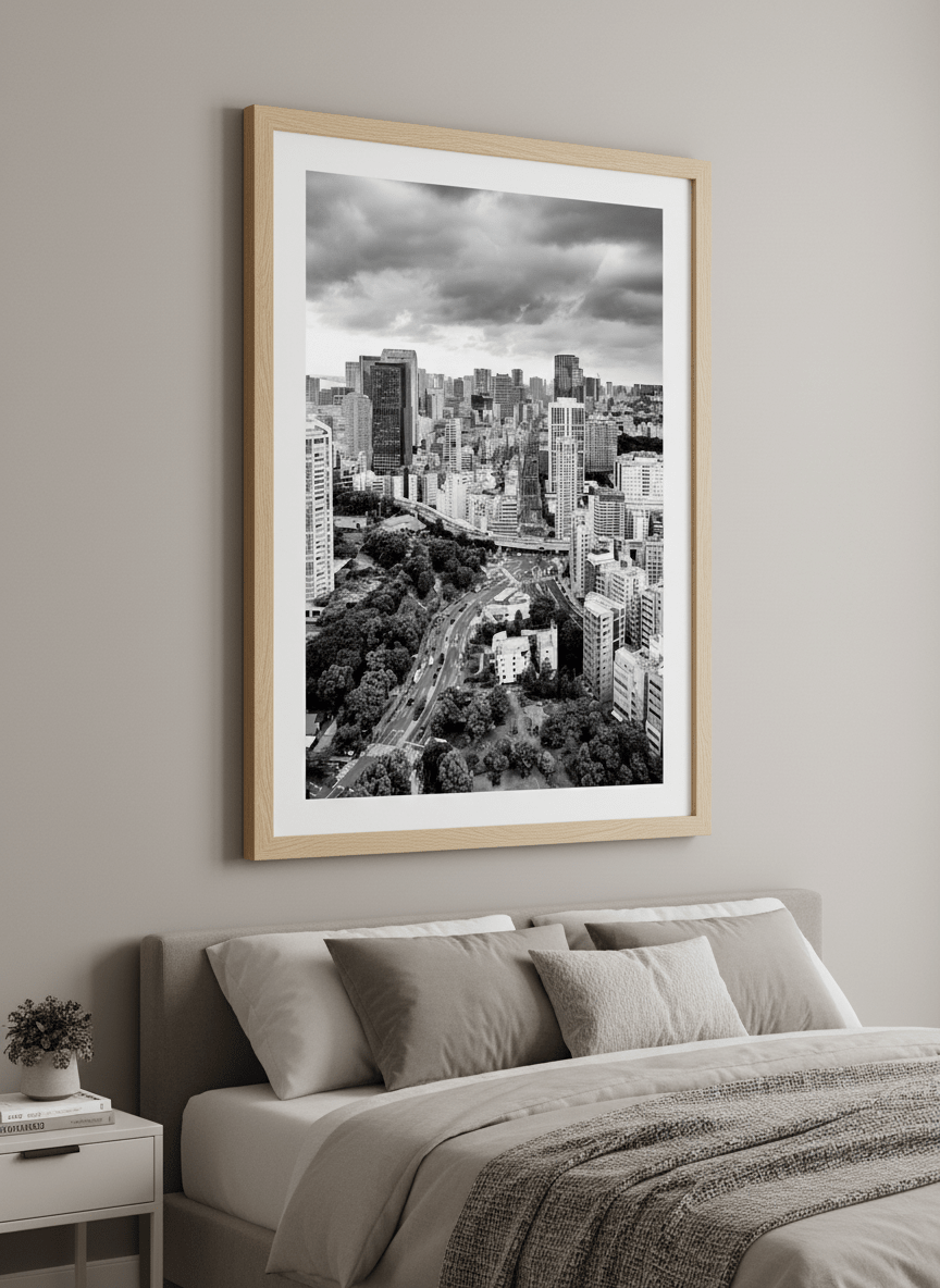Minimalist artwork displayed in a calm, light-filled bedroom interior