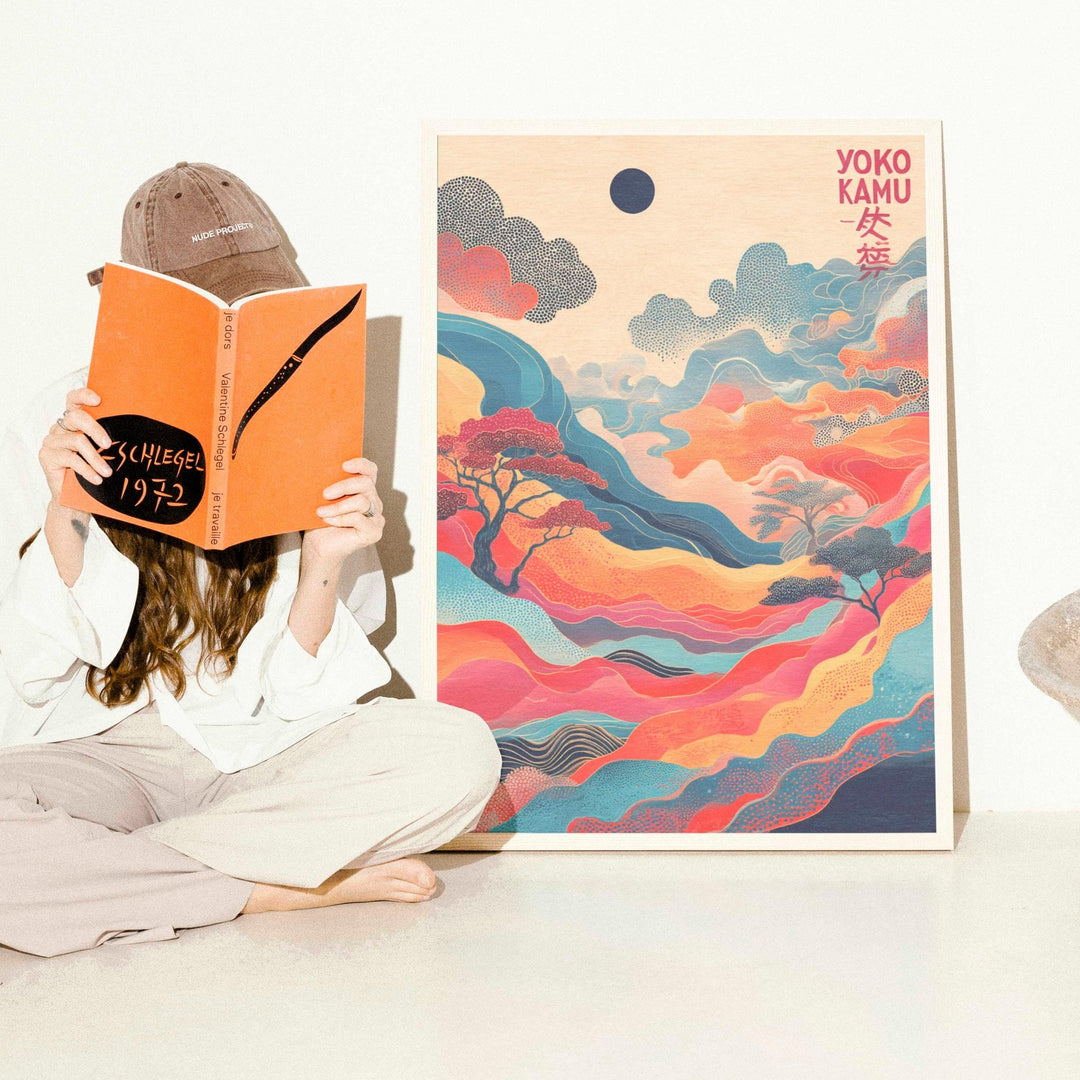 Person reading a book with a colorful abstract painting in the background