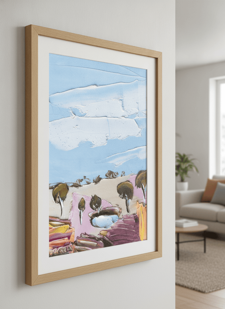Modern wall art styled above a sofa in a neutral living room