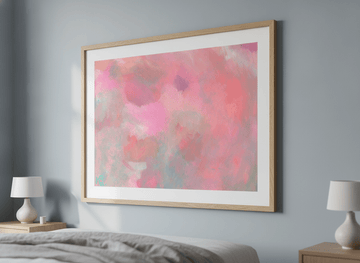 Minimalist artwork displayed in a calm, light-filled bedroom interior