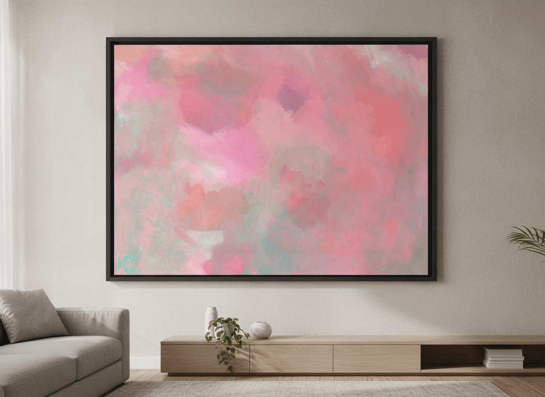 Modern wall art styled above a sofa in a neutral living room