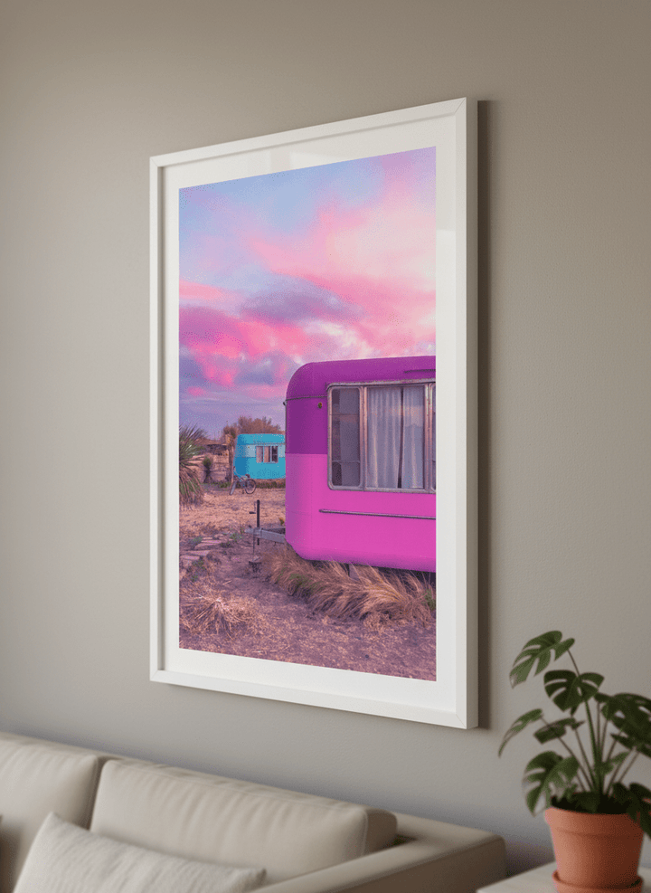 Modern wall art styled above a sofa in a neutral living room