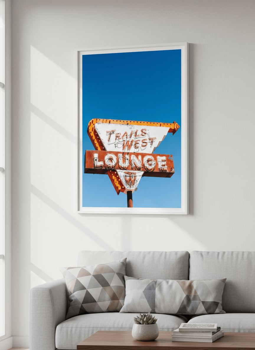 Modern wall art styled above a sofa in a neutral living room