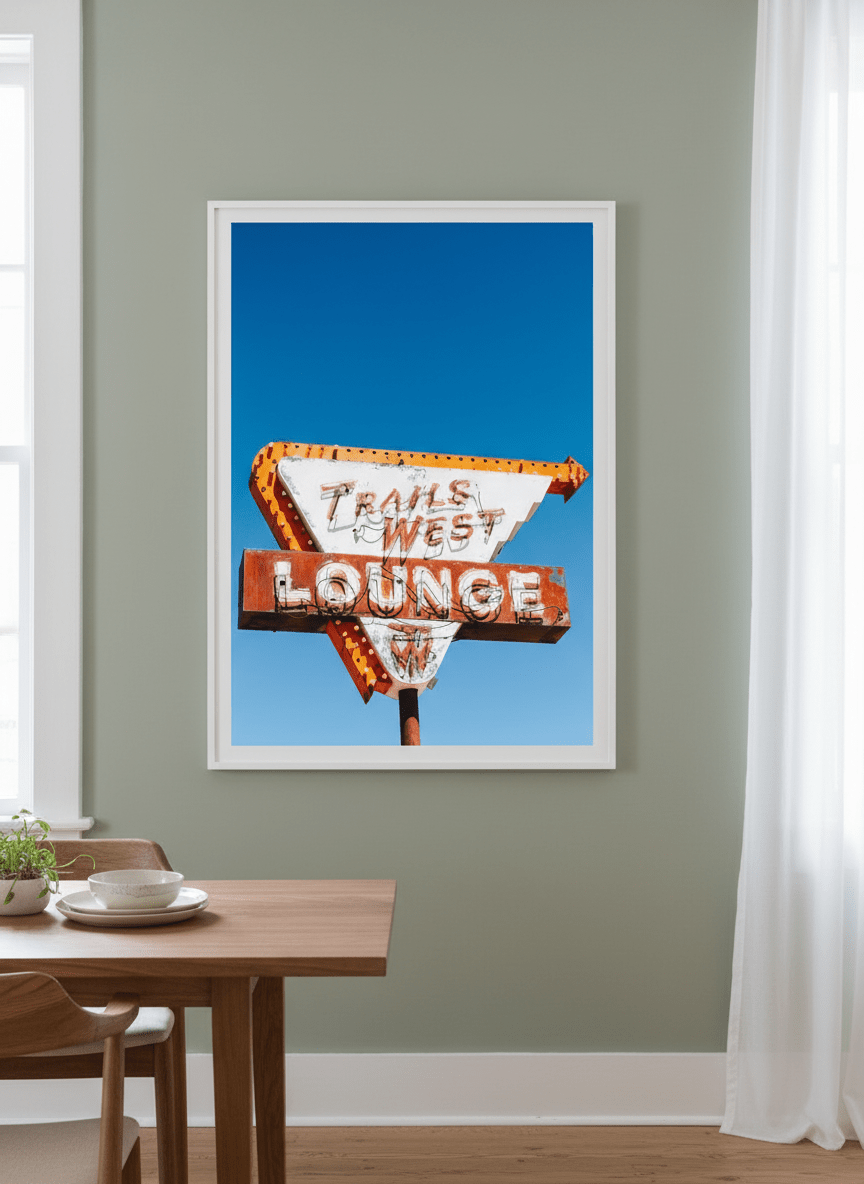 Wall art styled above a dining table in a contemporary home