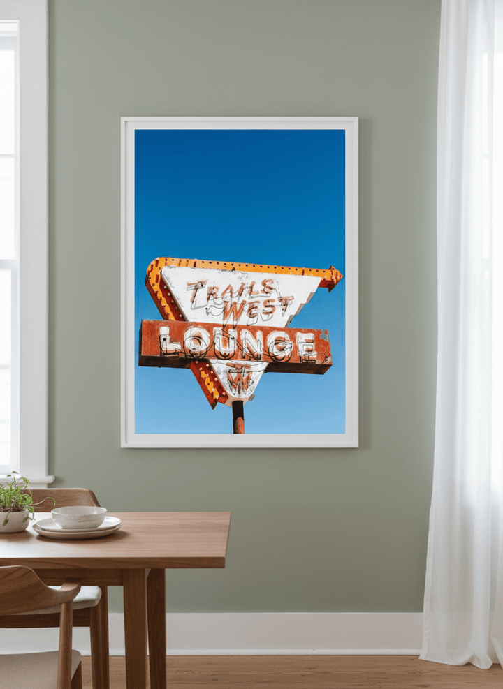 Wall art styled above a dining table in a contemporary home