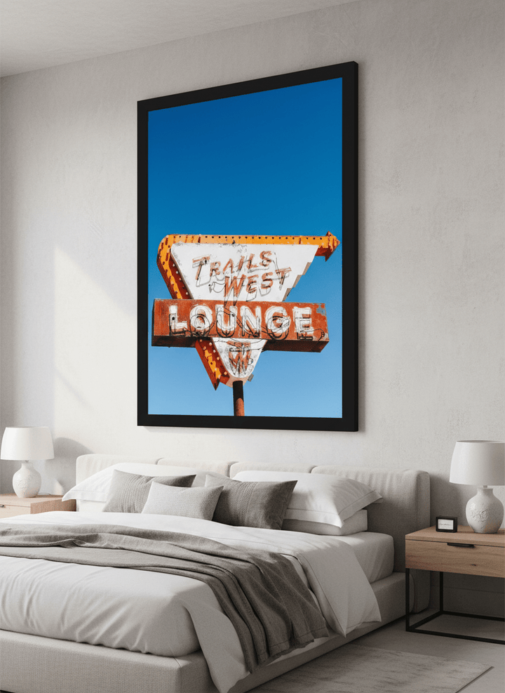 Minimalist artwork displayed in a calm, light-filled bedroom interior