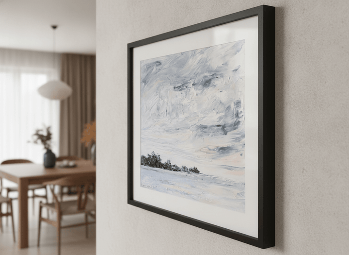 Wall art styled above a dining table in a contemporary home