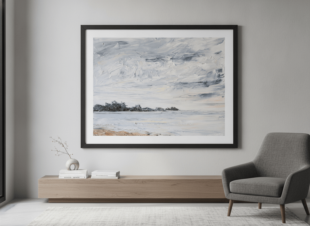 Modern wall art styled above a sofa in a neutral living room