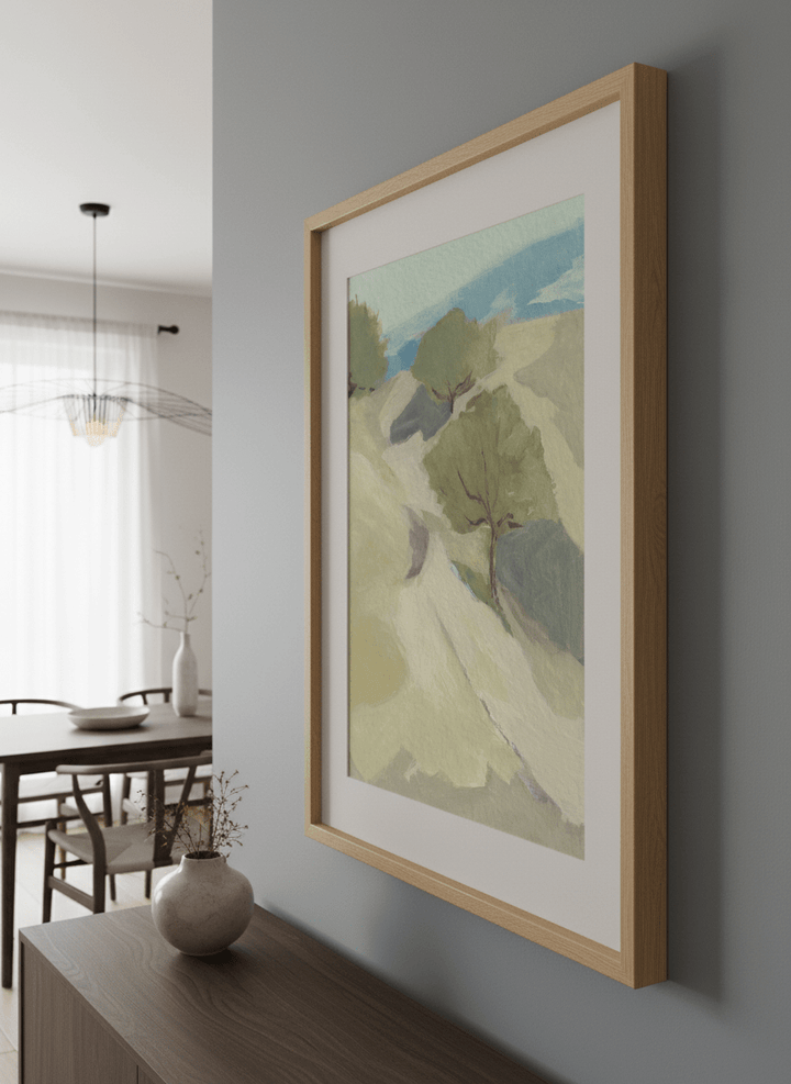 Wall art styled above a dining table in a contemporary home