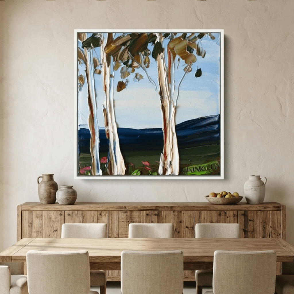 Oversized statement canvas wall art with a white surround styled in a contemporary dining room