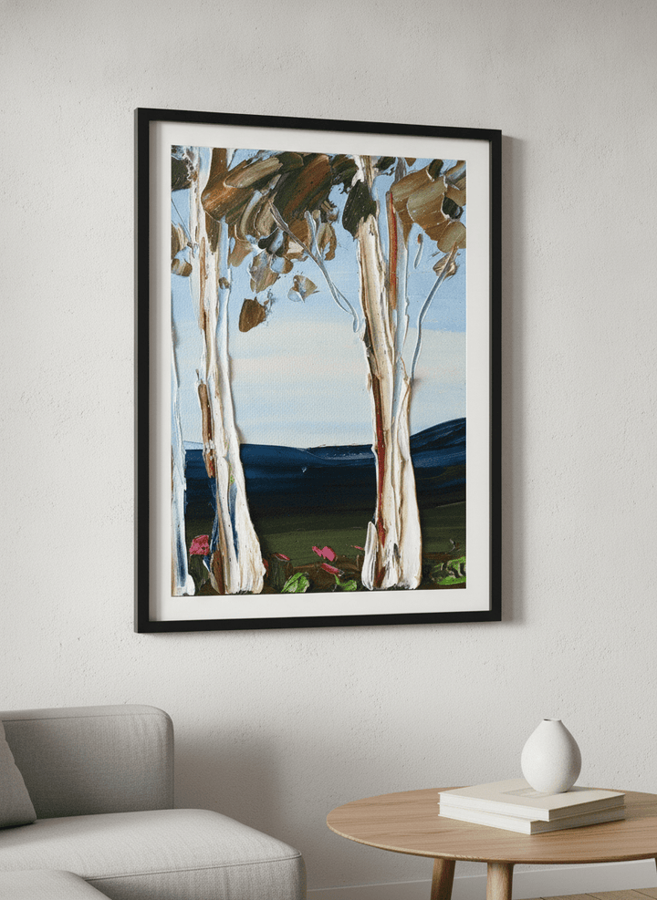 Modern wall art styled above a sofa in a neutral living room