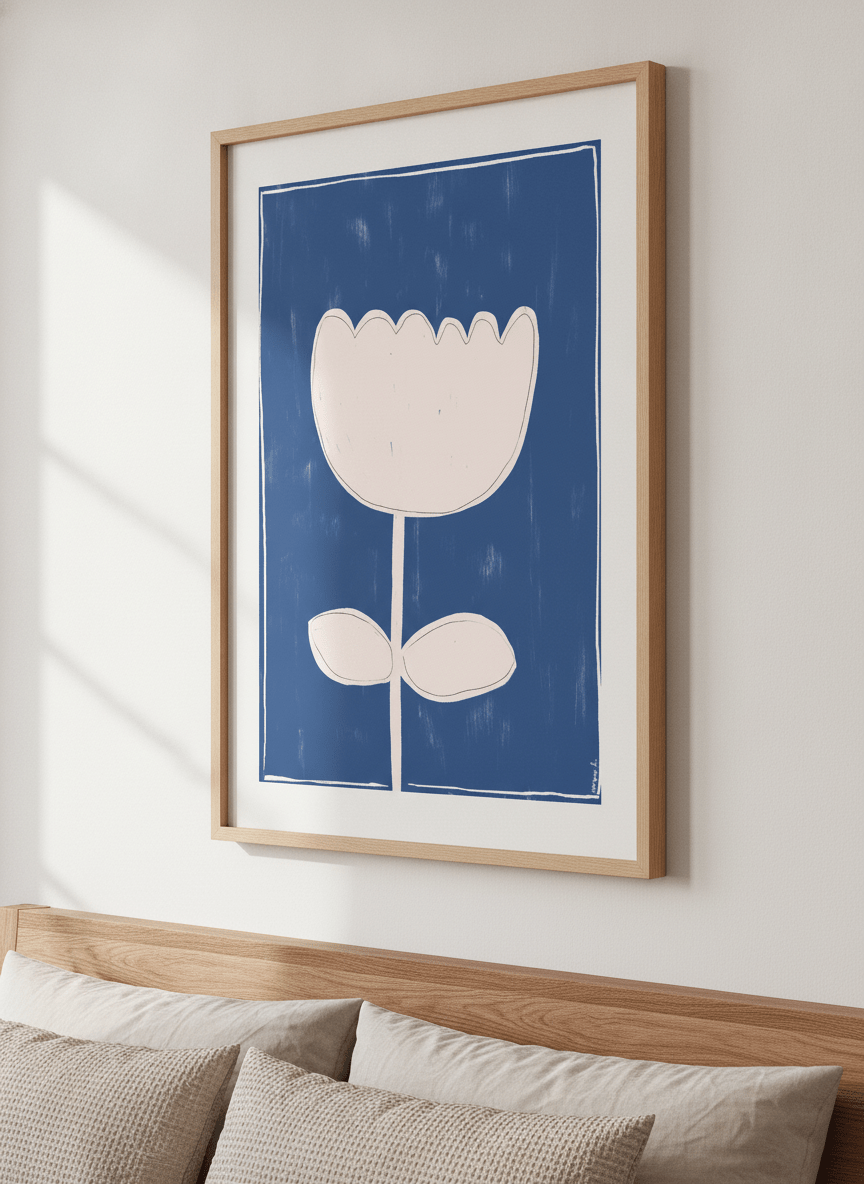 Minimalist artwork displayed in a calm, light-filled bedroom interior