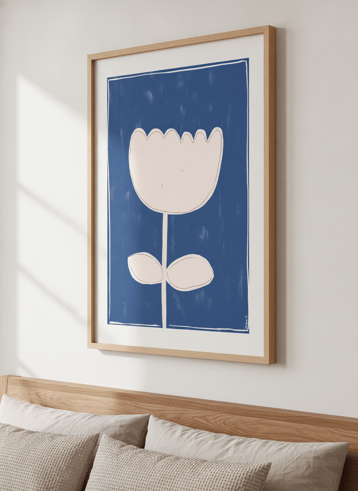 Minimalist artwork displayed in a calm, light-filled bedroom interior