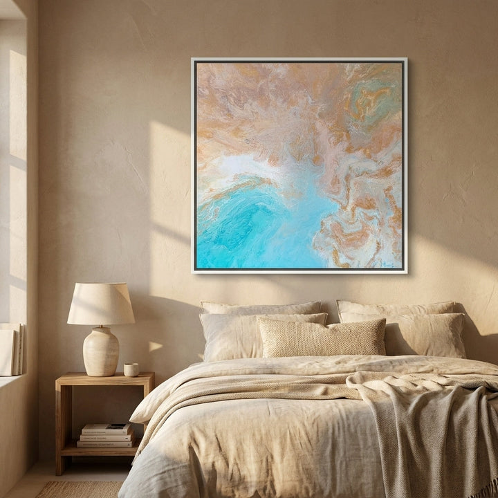 Canvas wall art with a white surround styled in a calm, light-filled bedroom
