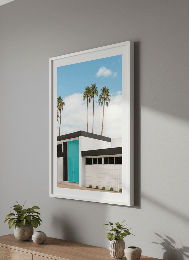 Wall art styled above a dining table in a contemporary home