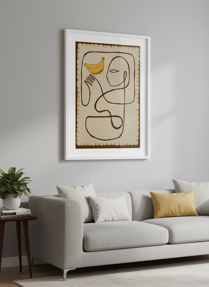 Modern wall art styled above a sofa in a neutral living room