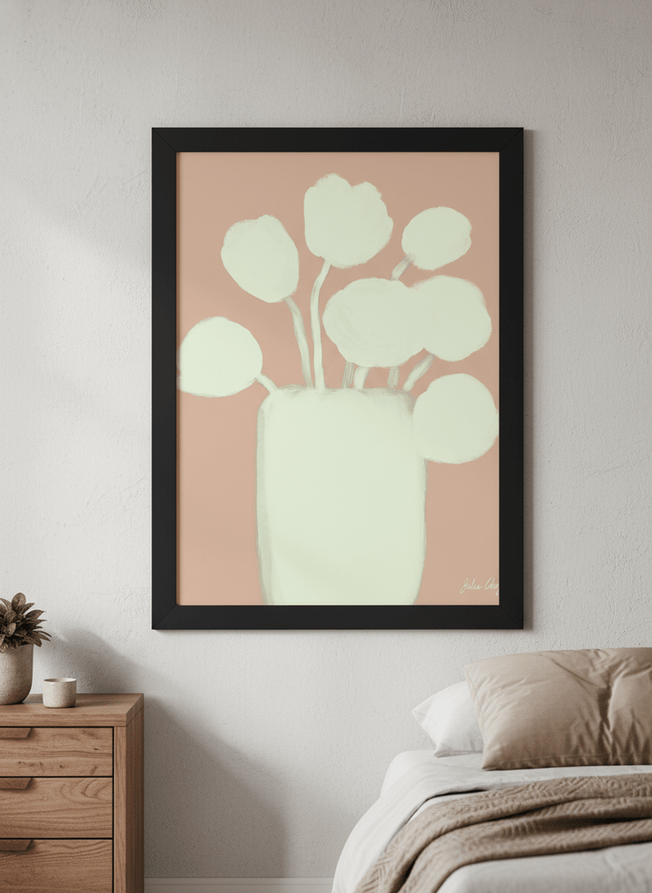 Minimalist artwork displayed in a calm, light-filled bedroom interior