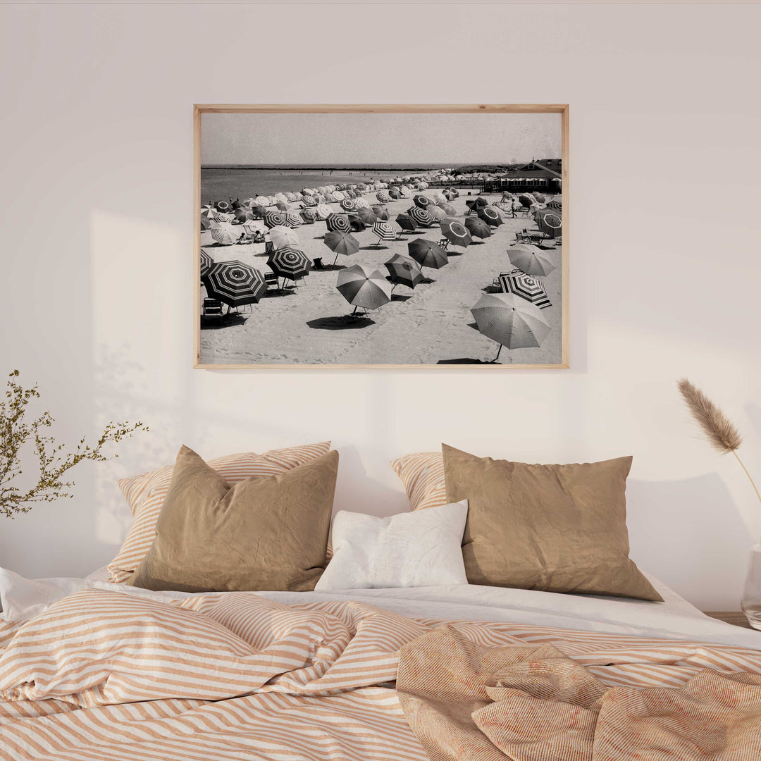 black and white umbrella coastal photography wall art timber border above bed