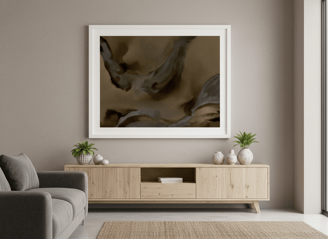 Modern wall art styled above a sofa in a neutral living room