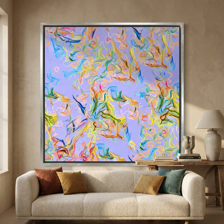 Canvas wall art with a silver leaf surround styled in a neutral living room