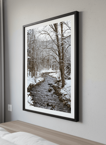 Minimalist artwork displayed in a calm, light-filled bedroom interior