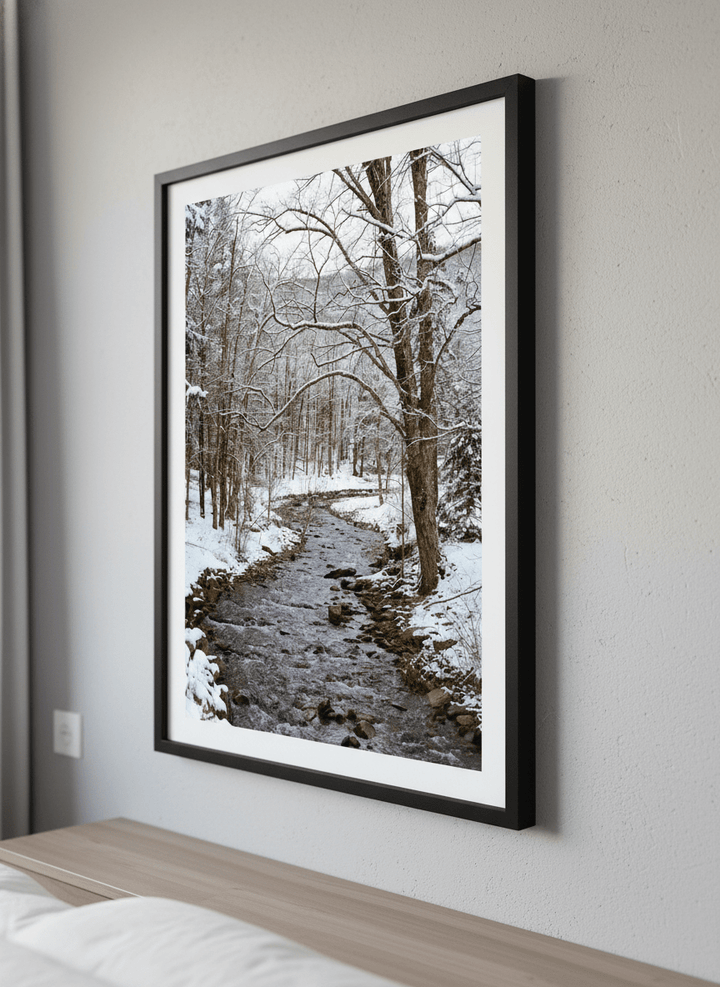 Minimalist artwork displayed in a calm, light-filled bedroom interior
