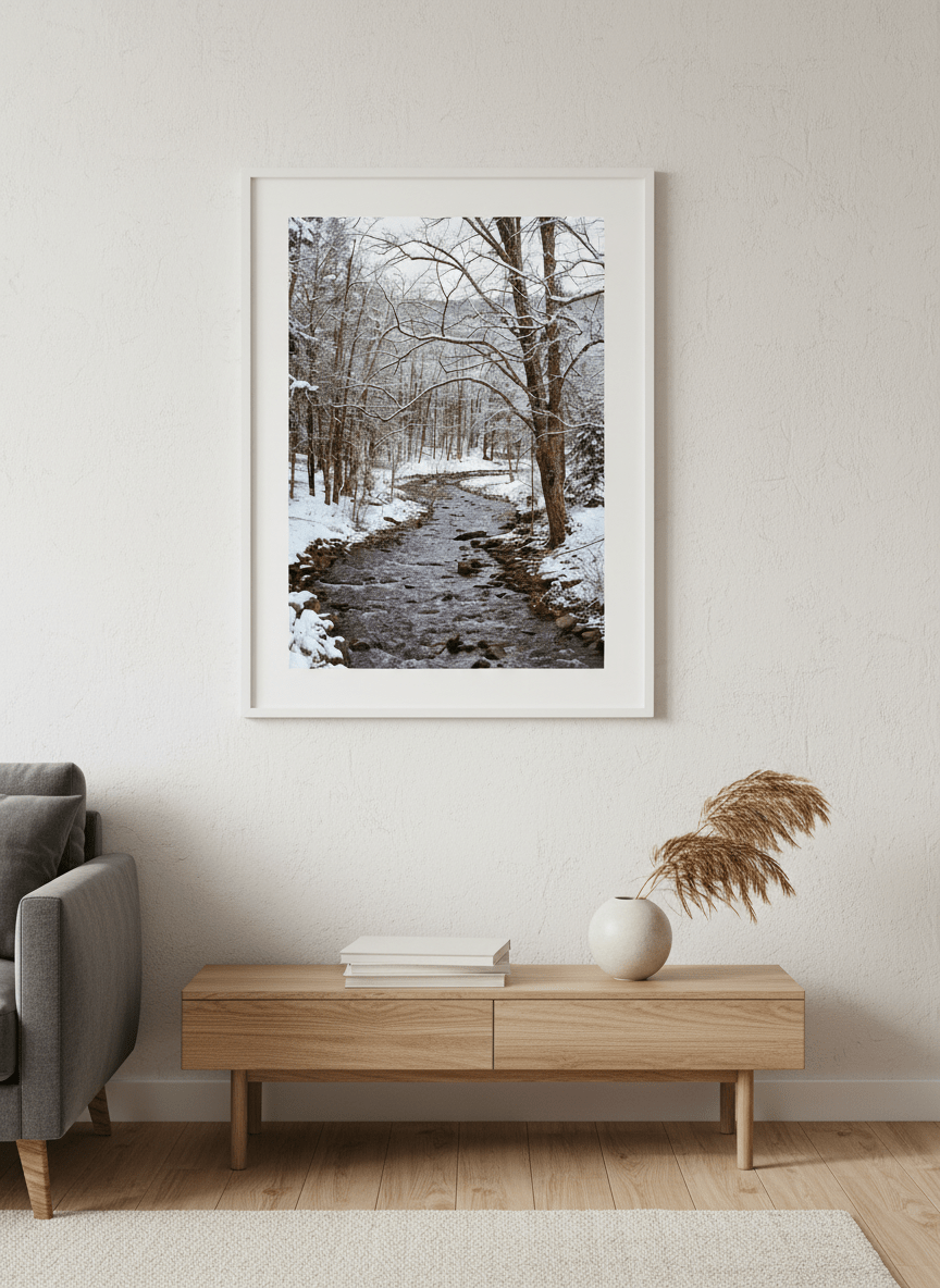 Modern wall art styled above a sofa in a neutral living room