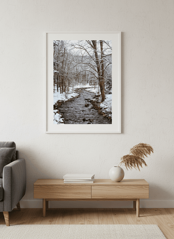 Modern wall art styled above a sofa in a neutral living room